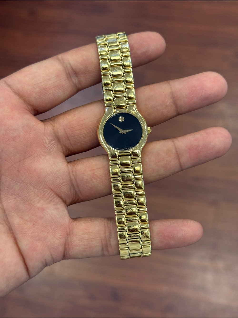 Movado classic Gold Tone women’s Bracelet Watch with Black Dial